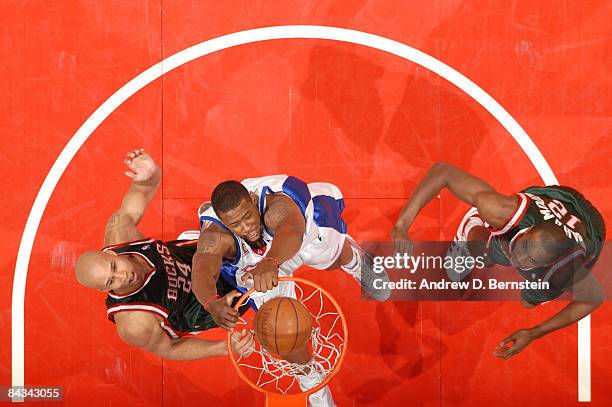 DeAndre Jordan of the Los Angeles Clippers dunks against Richard Jefferson and Luc Mbah a Moute of the Milwaukee Bucks at Staples Center on January...