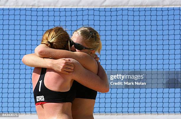 Linn Lehre and Mari Aase Hole of Norway embrace after defeating Australia in the bronze medal playoff during the Beach Volleyball on day five of the...