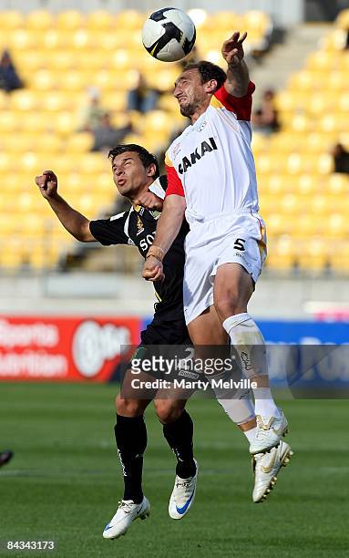 Costa Barbarouses of the Phoenix and Michael Valkanis of Adelaide jump for the ball during the round 20 A-League match between the Wellington Phoenix...