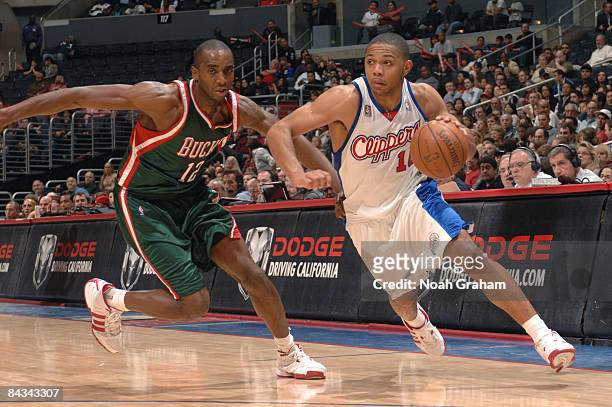 Eric Gordon of the Los Angeles Clippers dribbles past Luc Mbah a Moute of the Milwaukee Bucks at Staples Center on January 17, 2009 in Los Angeles,...
