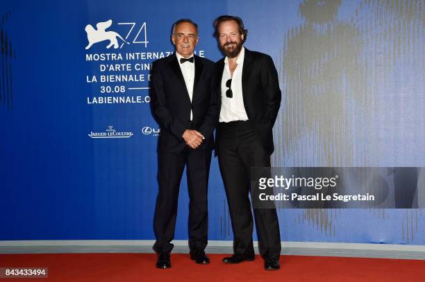 Festival director Alberto Barbera and Peter Sarsgaard walk the red carpet ahead of the 'Wormwood' screening during the 74th Venice Film Festival at...