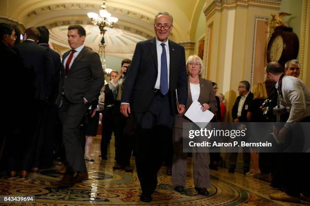 Senate Minority Leader Chuck Schumer, accompanied by Sen. Patty Murray , arrives to speak with reporters following the weekly Senate Democratic...