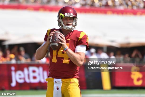 Sam Darnold warms up before a college football game between the Western Michigan Broncos and the USC Trojans on September 2 at Los Angeles Memorial...