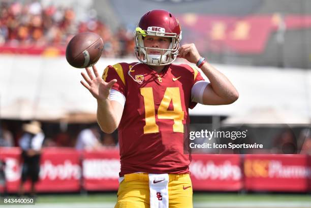 Sam Darnold warms up before a college football game between the Western Michigan Broncos and the USC Trojans on September 2 at Los Angeles Memorial...