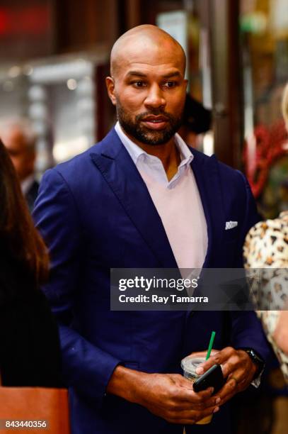 Professional NBA basketball coach and player Derek Fisher enters Planet Hollywood Times Square on September 06, 2017 in New York City.