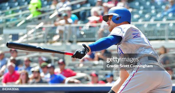 Will Middlebrooks of the Texas Rangers hits a fourth inning pinch hit triple against the Atlanta Braves at SunTrust Park on September 6, 2017 in...