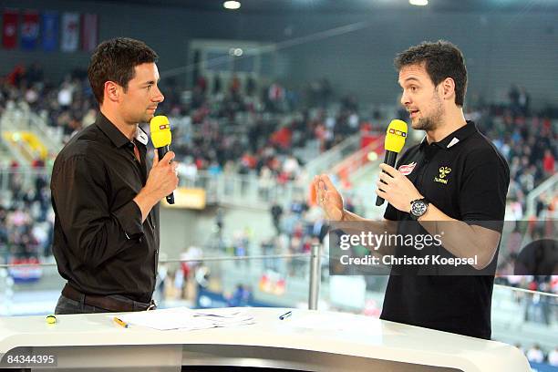 Television channel moderator Marcus Schreyl and Handball expert Markus Baur talks each other during the Men's World Handball Championships match...