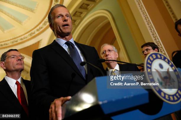 Sen. John Thune , accompanied by Sen. John Barrasso and Senate Majority Leader Mitch McConnell, speaks with reporters following the weekly Senate...