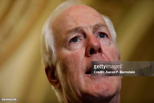 Senator John Cornyn speaks with reporters following the weekly Senate Republican policy luncheon at the U.S. Capitol September 6, 2017 in Washington,...