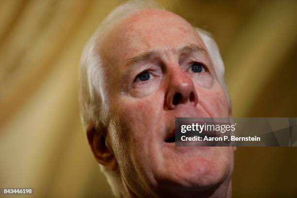 Senator John Cornyn speaks with reporters following the weekly Senate Republican policy luncheon at the U.S. Capitol September 6, 2017 in Washington,...