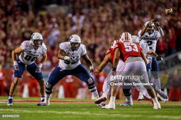 Utah State Aggies tight end Carson Terrell and Utah State Aggies offensive lineman Sean Taylor looking to block as the ball is snapped durning an...