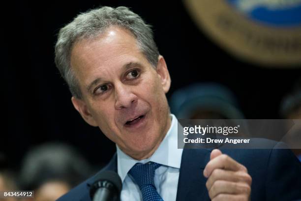 Surrounded by DACA recipients and immigration activists, New York Attorney General Eric Schneiderman speaks during a press conference to announce the...