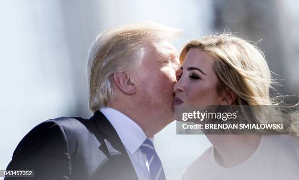 President Donald Trump kisses his daughter Ivanka Trump while speaking about the need for tax reform at Andeavor Refinery, September 6, 2017 in...