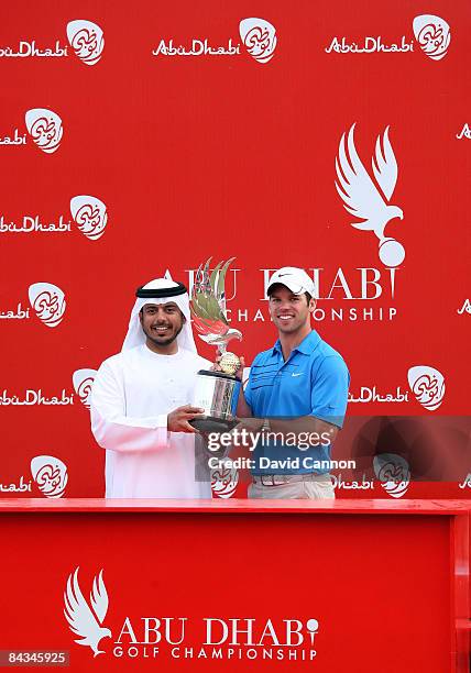 Paul Casey of England is presented with the trophy by His Highness Sheikh Sultan Bin Tahnoon Al Nahyan chairman of the Abu Dhabi Tourism Authority...