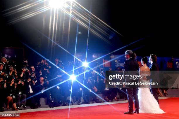 Javier Bardem, Penelope Cruz and Fernando Leon de Aranoa walk the red carpet ahead of the 'Loving Pablo' screening during the 74th Venice Film...