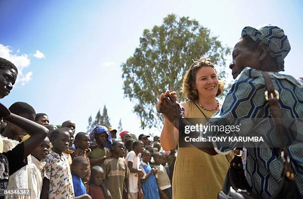 Tourists are welcomed on January 18, 2009 by villagers of Nyang'oma in Kogelo, Kenya's Nyanza province. Two days to Obama's historic installation as...