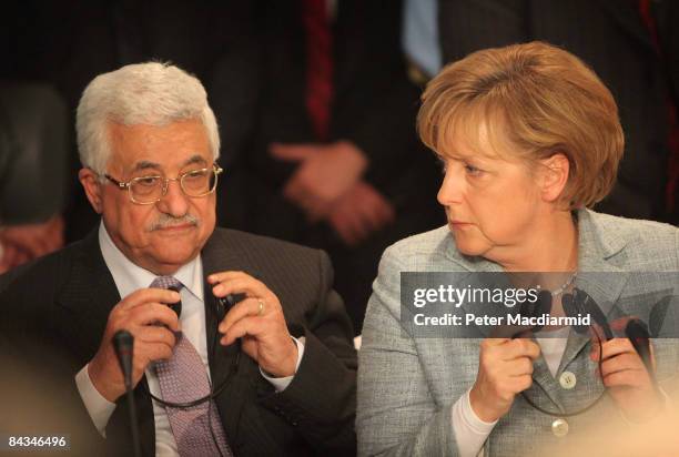 Palestinian President Mahmoud Abbas and German Chancellor Angela Merkel attend an international summit on Gaza on January 18, 2009 in Sharm El...