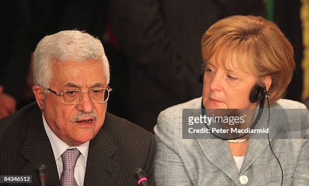 Palestinian President Mahmoud Abbas and German Chancellor Angela Merkel attend an international summit on Gaza on January 18, 2009 in Sharm El...