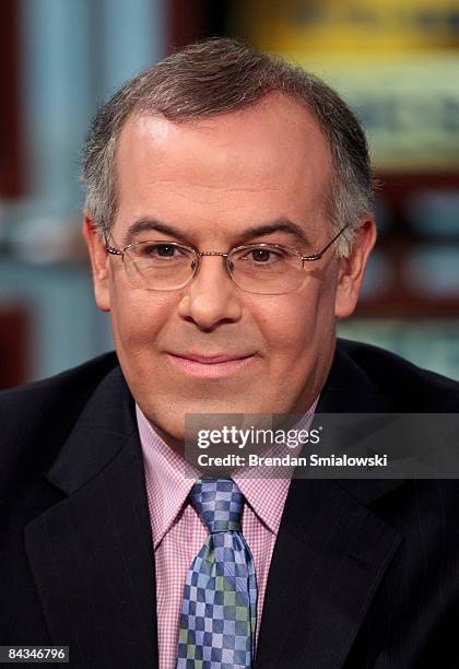 Political commentator and columnist for the New York Times, David Brooks listens during a pre-taping of "Meet the Press" at NBC studios January 18,...