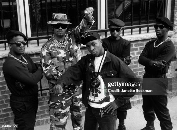 Portrait of the rap hiphop group Public Enemy. Chuck D, leader of the group, stands in the center of the band, 1987. New York.