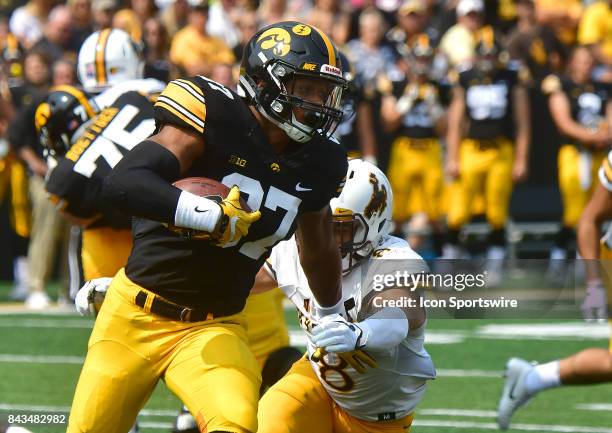 Iowa Hawkeyes' tight end Noah Fant runs after making a catch during a non-conference college football game between the Wyoming Cowboys and the Iowa...