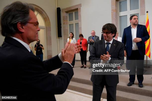 Former President of the Catalan Government and leader of Partit Democrata Europeu Catala PDECAT Artur Mas applauds President of the Catalan...