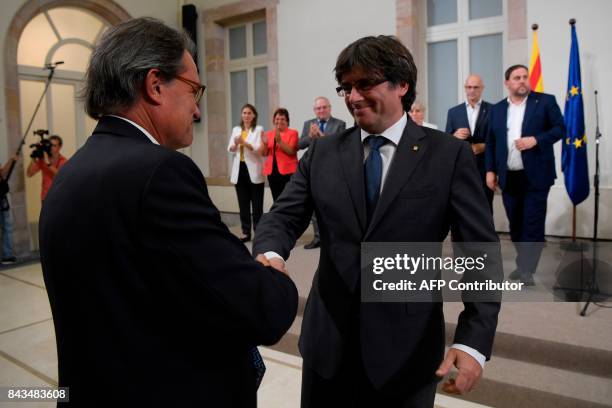Former President of the Catalan Government and leader of Partit Democrata Europeu Catala PDECAT Artur Mas applauds President of the Catalan...
