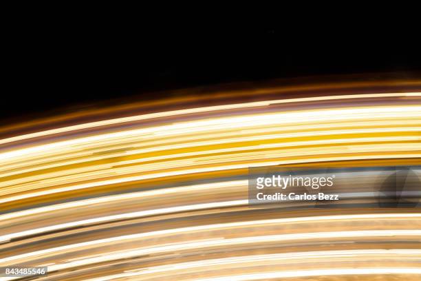 spinning lights - spinnrad stock-fotos und bilder