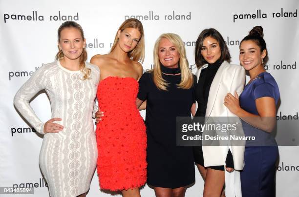 Guest, Model Nadine Leopold, designer Pamella Roland, actress Olivia Culpo and Olympic gymnast Aly Raisman pose backstage for the Pamella Roland...