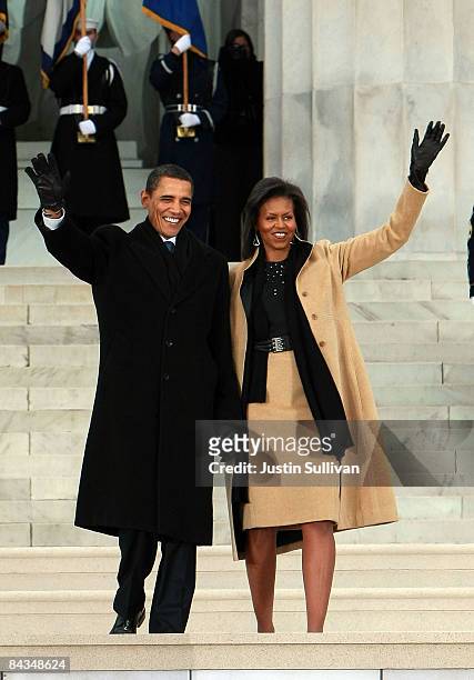 President-elect Barack Obama and his wife Michelle walk down the stairs of the Lincoln Memorial during the "We Are One: The Obama Inaugural...