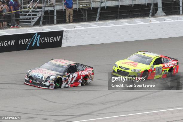 Ricky Stenhouse Jr , driver of the Go Bowling Ford, and Dale Earnhardt, Jr. , driver of the Axalta Chevrolet, race during the Monster Energy NASCAR...