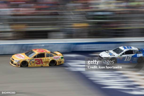 Ryan Newman , driver of the Velveeta Shells & Cheese Chevrolet, races against Danica Patrick , driver of the Code 3 Associates Ford, during the...