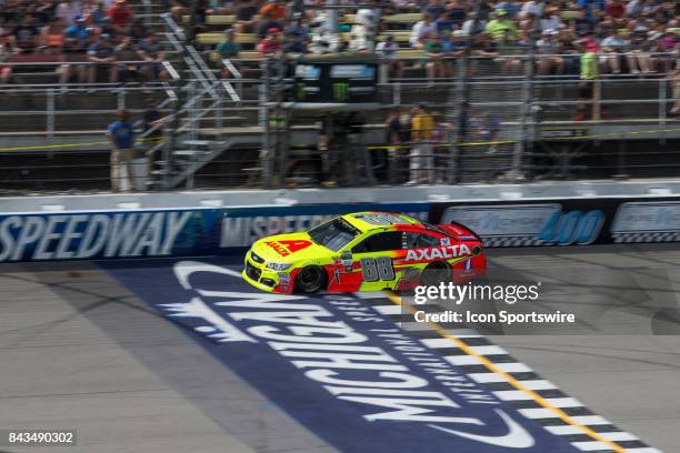 Dale Earnhardt, Jr. , driver of the Axalta Chevrolet, races during the Monster Energy NASCAR Cup Series - Pure Michigan 400 race on August 13, 2017...