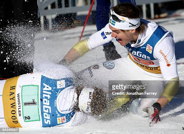 Emil Joensson and Robin Bryntesson of Sweden celebrate their victory in the Men's 6 x 1.6K F Team Sprint during day 4 of the FIS Cross Country World...