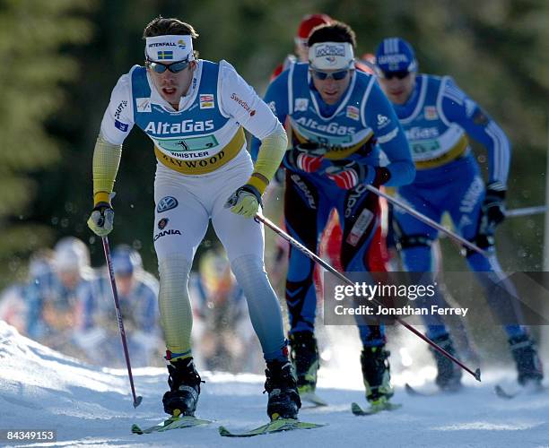 Emil Joensson of Sweden leads a pack of skiers in the Men's 6 x 1.6K F Team Sprint during day 4 of the FIS Cross Country World Cup on January 18,...