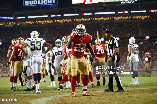 Tim Hightower of the San Francisco 49ers celebrates after scoring a touchdown during the game against the Los Angeles Chargers at Levi's Stadium on...