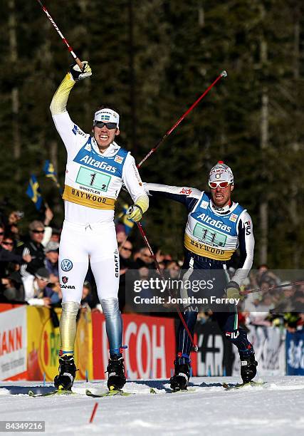 Emil Joensson of Sweden celebrates crossing the finish line to win ahead of Renato Pasini of Italy in the Men's 6 x 1.6K F Team Sprint during day 4...