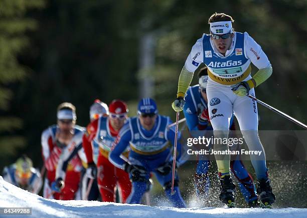 Emil Joensson of Sweden leads a pack of skiers in the Men's 6 x 1.6K F Team Sprint during day 4 of the FIS Cross Country World Cup on January 18,...