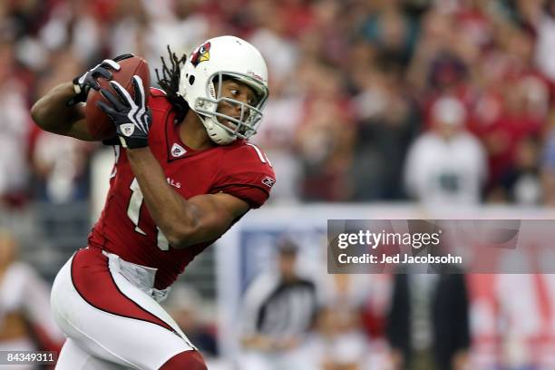 Wide receiver Larry Fitzgerald of the Arizona Cardinals runs into the endzone to score a 62-yard touchdown in the second quarter against the...