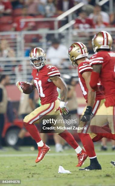Asa Jackson of the San Francisco 49ers returns an interception during the game against the Los Angeles Chargers at Levi's Stadium on August 31, 2017...