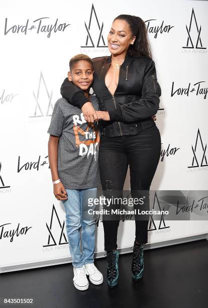 Designer La La Anthony poses with her son Kiyan Carmelo Anthony during the launch of the "La La Anthony Denim Collection" at Lord & Taylor on...