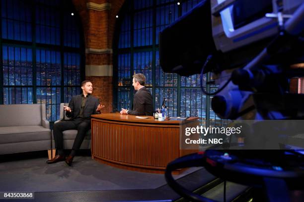 Episode 573 -- Pictured: Host of The Daily Show Trevor Noah talks with host Seth Meyers during an interview on September 6, 2017 --