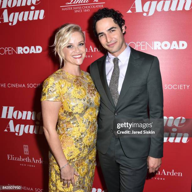 Actress Reese Witherspoon and Designer Zac Posen attend The Cinema Society with Elizabeth Arden & Lindt Chocolate host a screening of Open Road...