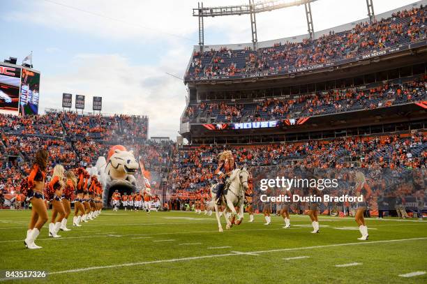 Thunder and Ann Judge-Wegener lead the Denver Broncos onto the field before a Preseason game before a preseason NFL game between the Denver Broncos...