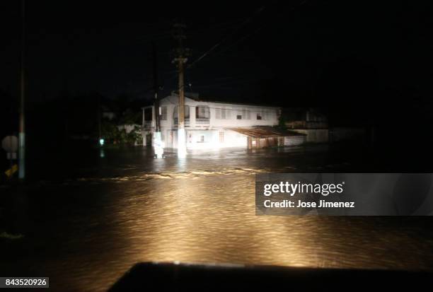 Rescue team from the local emergency management agency inspects flooded areas after the passing of Hurricane Irma on September 6, 2017 in Fajardo,...