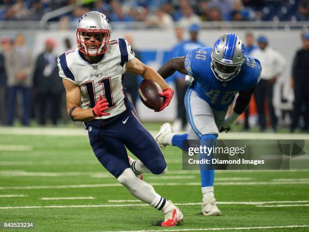 Wide receiver Julian Edelman of the New England Patriots carries the ball downfield in the first quarter of a preseason game on August 25, 2017...