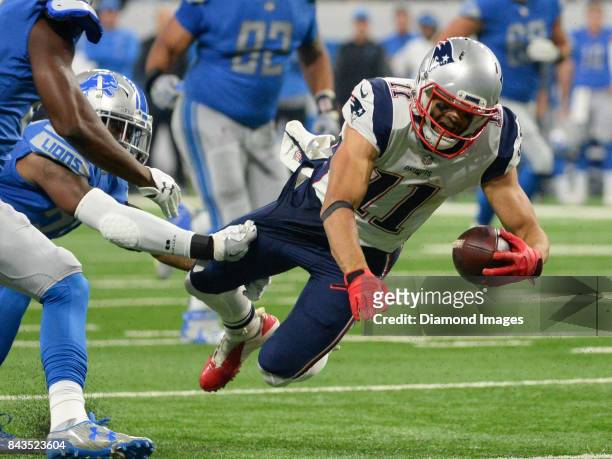 Wide receiver Julian Edelman of the New England Patriots goes down after injuring his knee in the first quarter of a preseason game on August 25,...