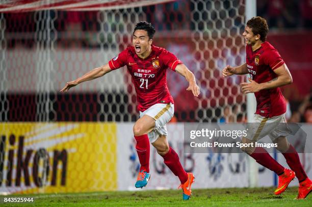 Guangzhou Evergrande midfielder Zhao Xuri celebrates after scoring his goal during the AFC Champions League 2015 Group Stage H match between...