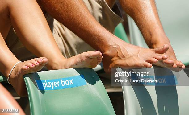 Spectators air their toes during the first round match against Brydan Klein of Australia and Bjorn Phau of Germany during day one of the 2009...