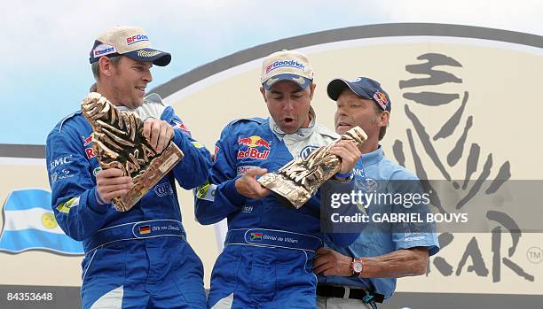 Volkswagen's co-driver Dirk Von Zitzewitz of Germany , driver Giniel De Villiers of South Africa and Volkswagen Motorsport Director, Kris Nissen...